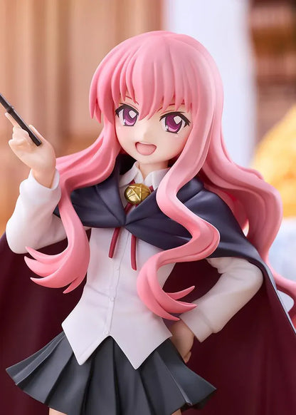POP UP PARADE Louise L Size figure with flowing pink hair, a raised wand, white blouse, dark skirt, and a cape with burgundy lining.