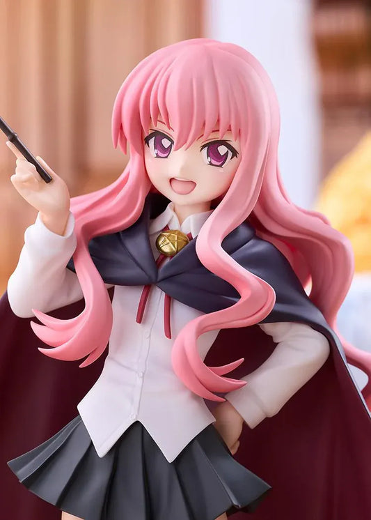 POP UP PARADE Louise L Size figure with flowing pink hair, a raised wand, white blouse, dark skirt, and a cape with burgundy lining.