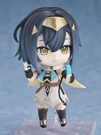 Stella Sora Nendoroid Amber Figure featuring a dark blue-haired anime girl with golden eyes wearing a white and teal outfit with gold accents, black gloves, armored boots, and holding two silver weapons.