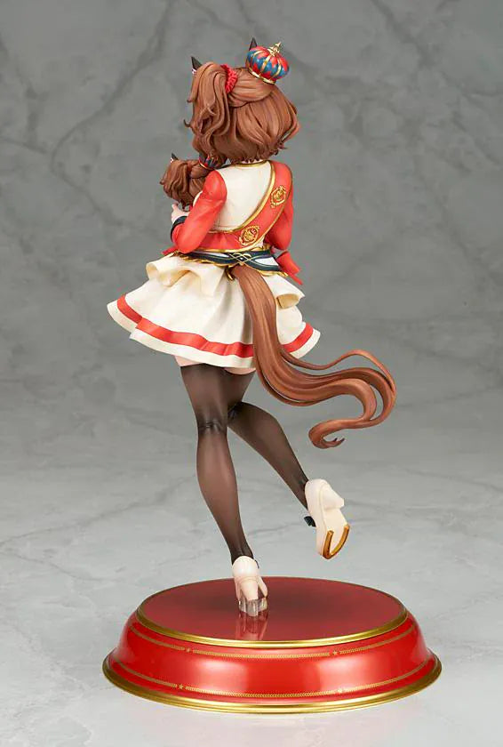 UmaMusume Pretty Derby Aston Machan 1/7 Scale Figure featuring Aston Machan with horse ears, short brown hair, red-and-cream outfit, plush doll accessory, and themed display base.