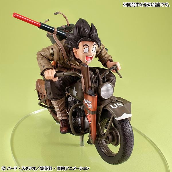 “Dragon Ball Z Desktop Real McCoy EX figure of Kid Goku riding a detailed military-style motorbike with gear and accessories.”