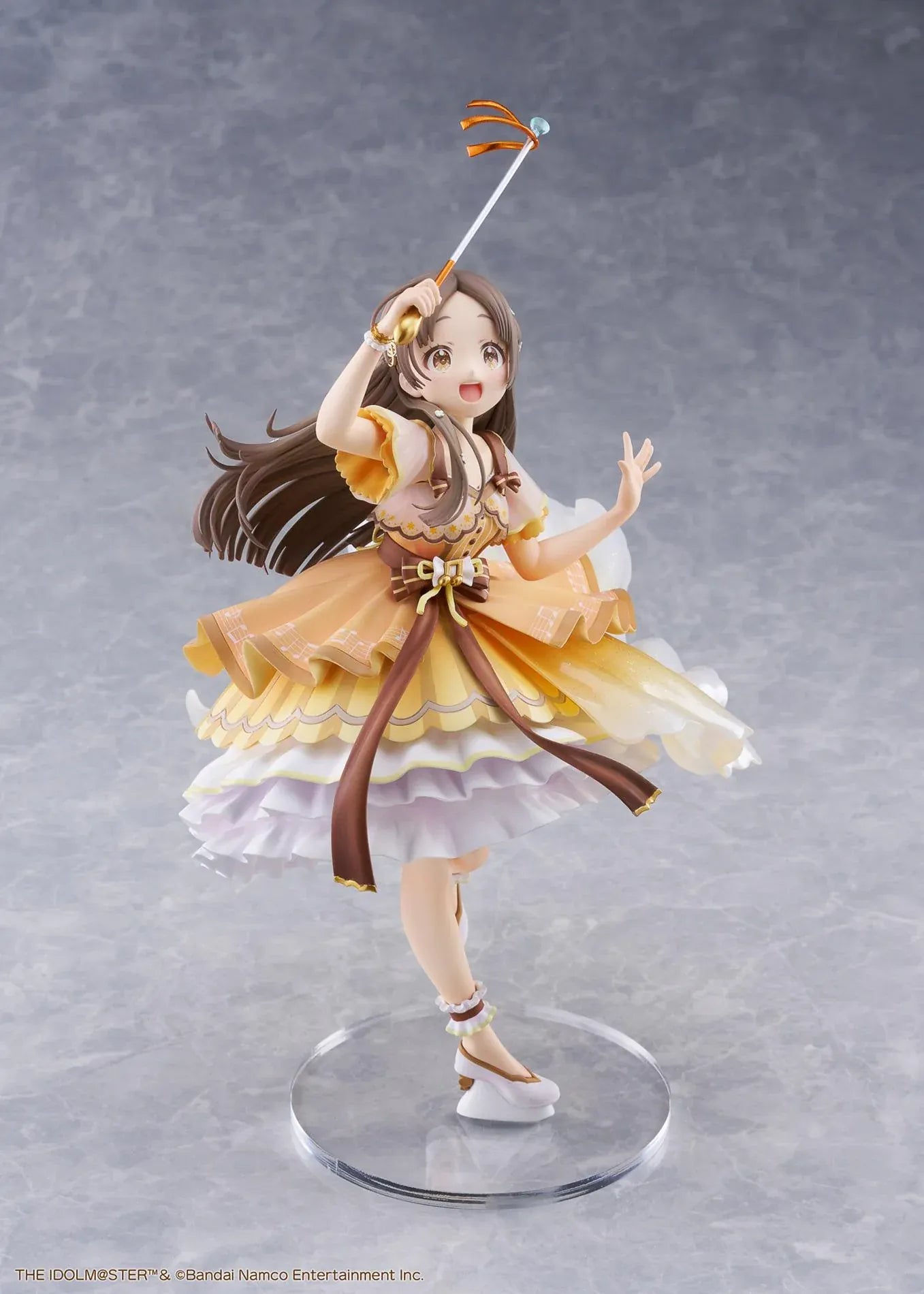 The Idolmaster Gakuen China Kuramoto 1/7 scale anime figure in a flowing yellow stage dress holding a microphone