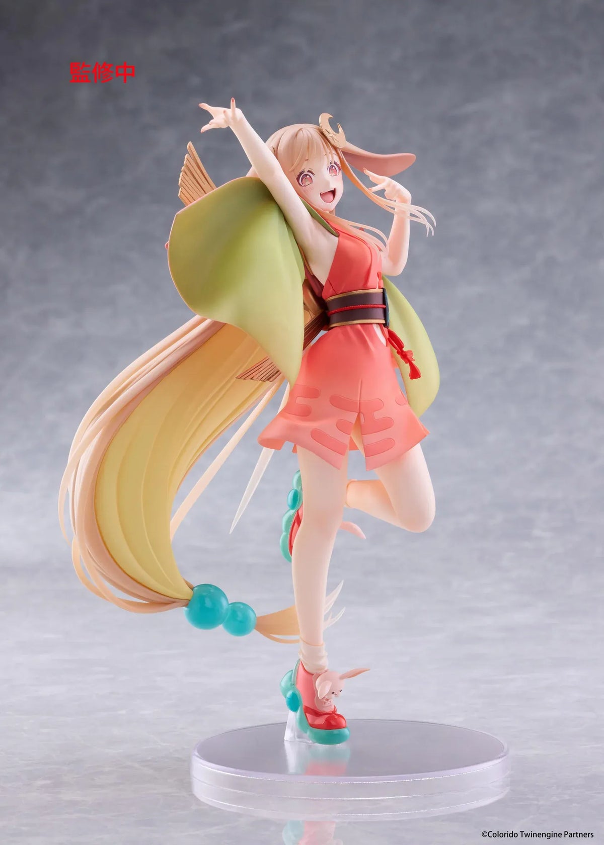 Cosmic Princess Kaguya! Kaguya VR Ver. Coreful Figure featuring a blonde-haired anime girl with pink eyes, long flowing hair, bunny ears, a crescent moon hair accessory, a coral-pink outfit with green sleeves, and colorful shoes in an energetic pose on a transparent circular base.
