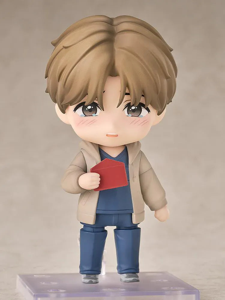 Jinx Nendoroid Kim Dan Figure featuring Kim Dan in a chibi style with brown hair, a casual outfit, yellow notebook, and black shoulder bag.
