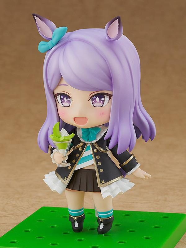 Umamusume Pretty Derby Nendoroid Mejiro McQueen rerelease figure with lavender hair, horse ears, and a black-and-teal racing uniform.