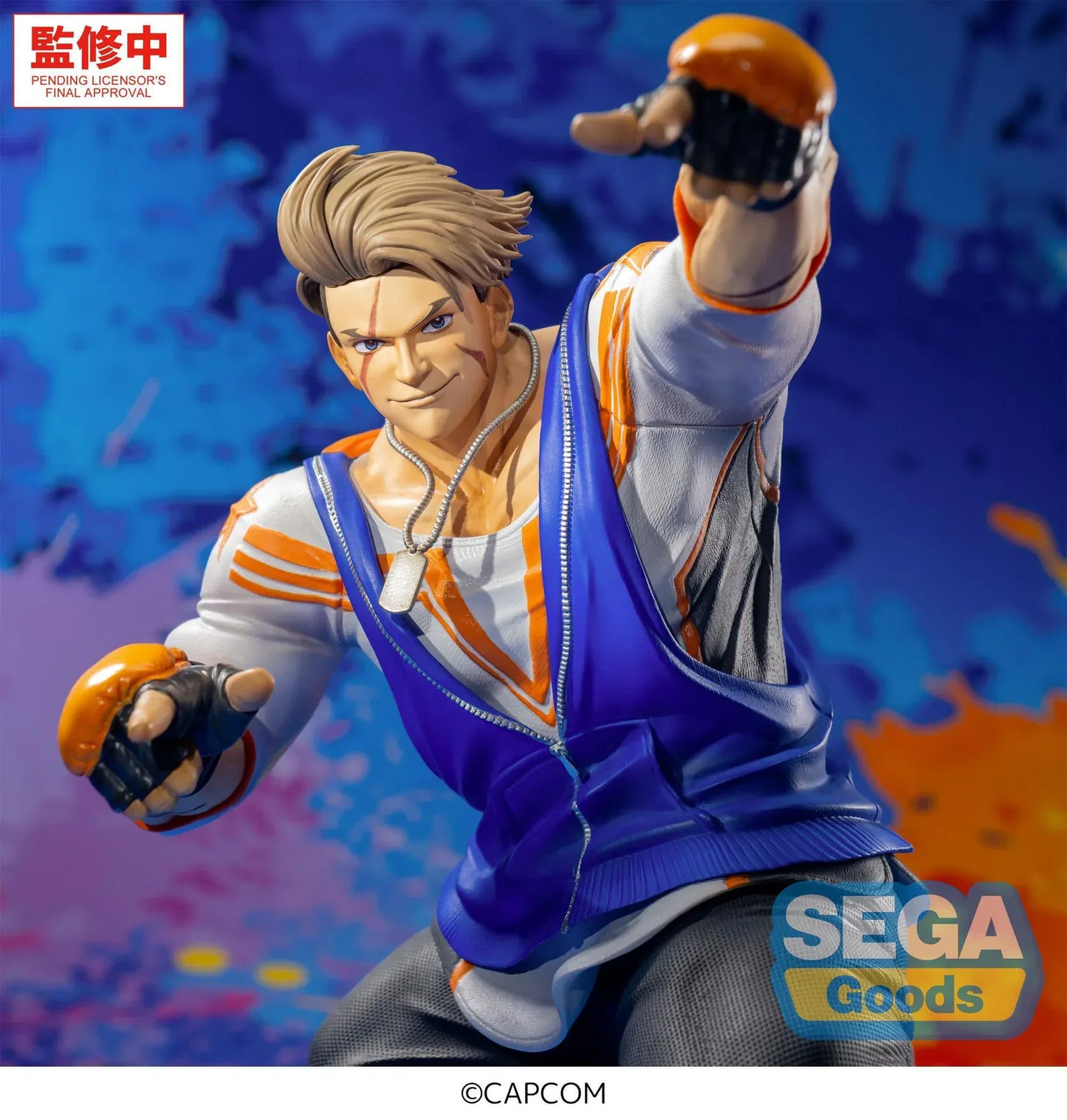 Street Fighter 6 FiGURiZMa Luke Figure in a dynamic fighting stance with blue and orange outfit and fingerless gloves
