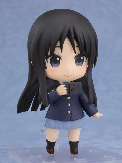 K-ON! Nendoroid Mio Akiyama 2.0 figure with long black hair, her school uniform, blue ribbon, and left-handed bass guitar.