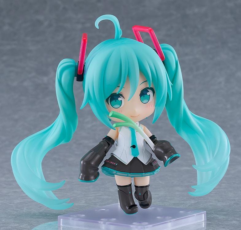 Hatsune Miku Nendoroid Hatsune Miku HMO Ver. Figure featuring Miku with teal twin tails, red glasses, colorful cable-style hair accessories, and music-inspired outfit details.