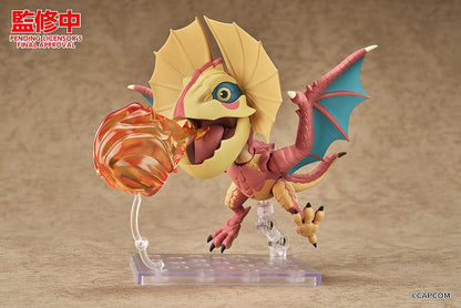 Monster Hunter Nendoroid Yian Kut-Ku with yellow ear fans, an open beak, pink-red scales, and spread wings with turquoise membranes.