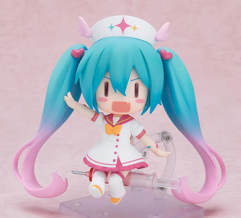 Hatsune Miku Nendoroid MAGICAL CURE LOVE SHOT Figure with teal pink twin-tails, magical nurse outfit, heart details, and starry eyes