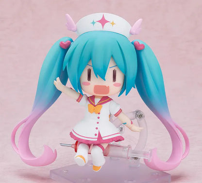 Hatsune Miku Nendoroid MAGICAL CURE LOVE SHOT Figure with teal pink twin-tails, magical nurse outfit, heart details, and starry eyes