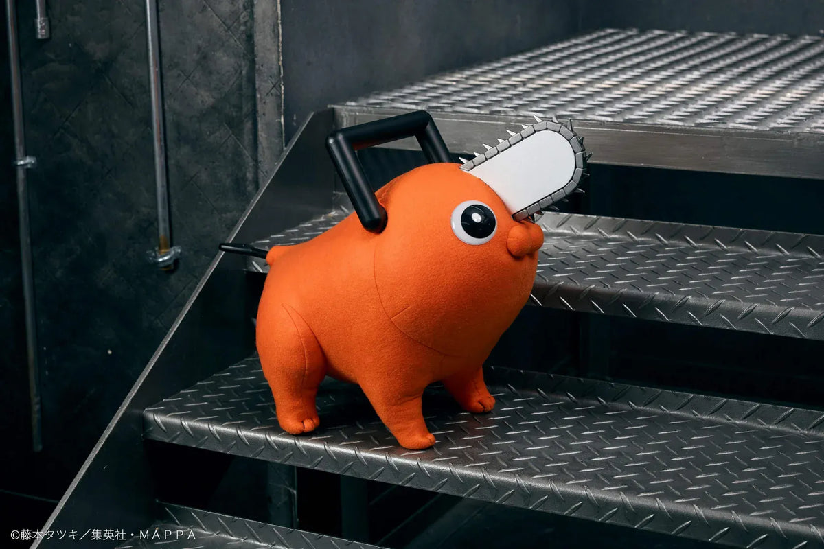 Chainsaw Man life-size Pochita doll figure with an orange body, glossy eyes, chainsaw blade, black handle, and pull cord.