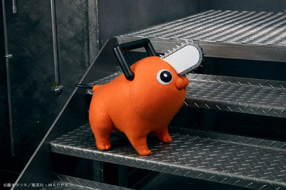 Chainsaw Man life-size Pochita doll figure with an orange body, glossy eyes, chainsaw blade, black handle, and pull cord.
