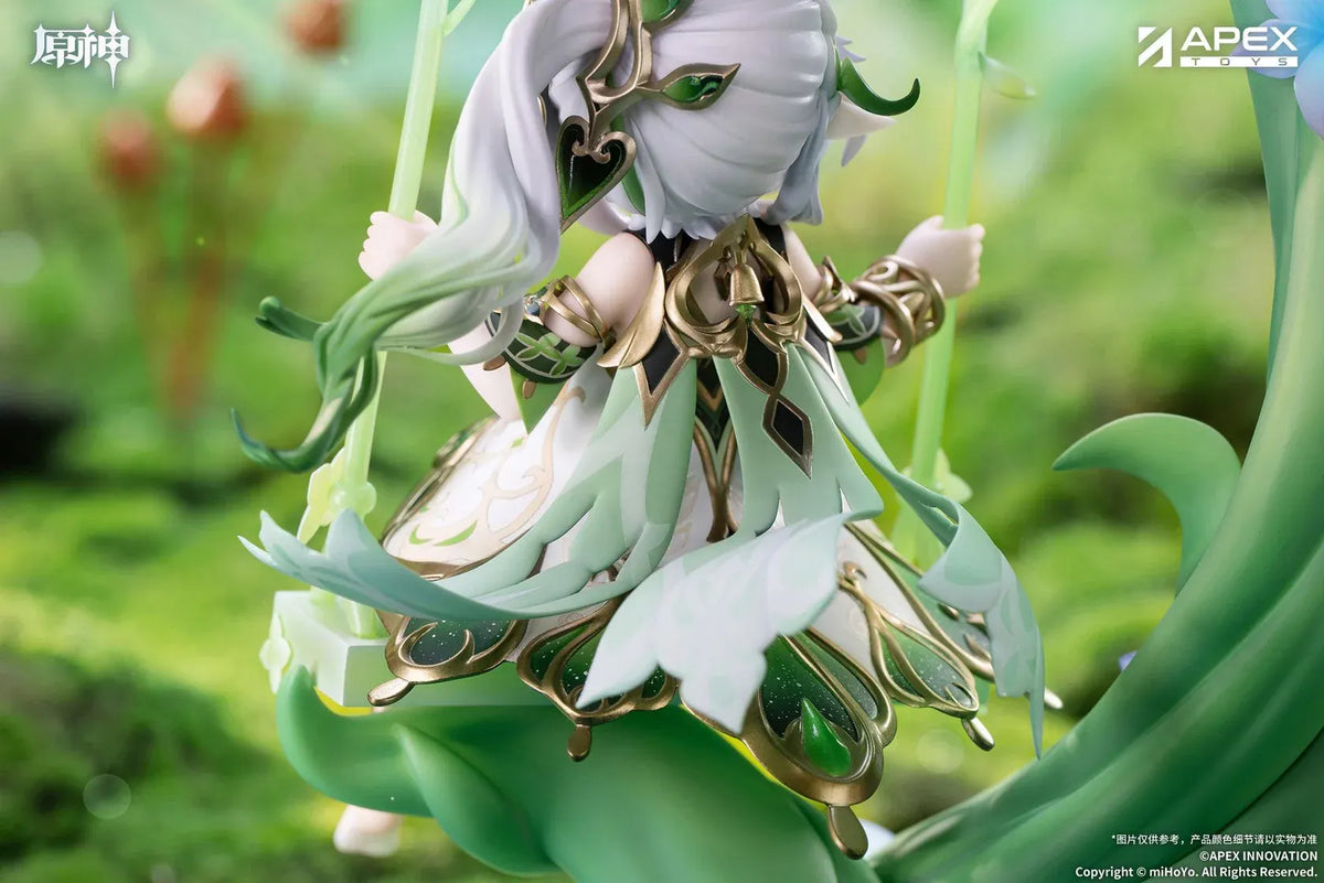 Genshin Impact Nahida Physic of Purity Ver. 1/7 scale figure seated on a green swing surrounded by vines, leaves, and colorful flowers.
