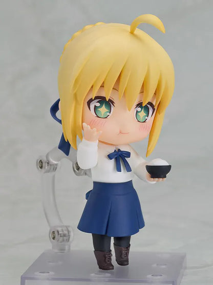 Fate stay night Nendoroid Saber Casual Outfit Ver. Figure featuring Saber with blonde hair, green eyes, white blouse, blue skirt, and sword accessory.