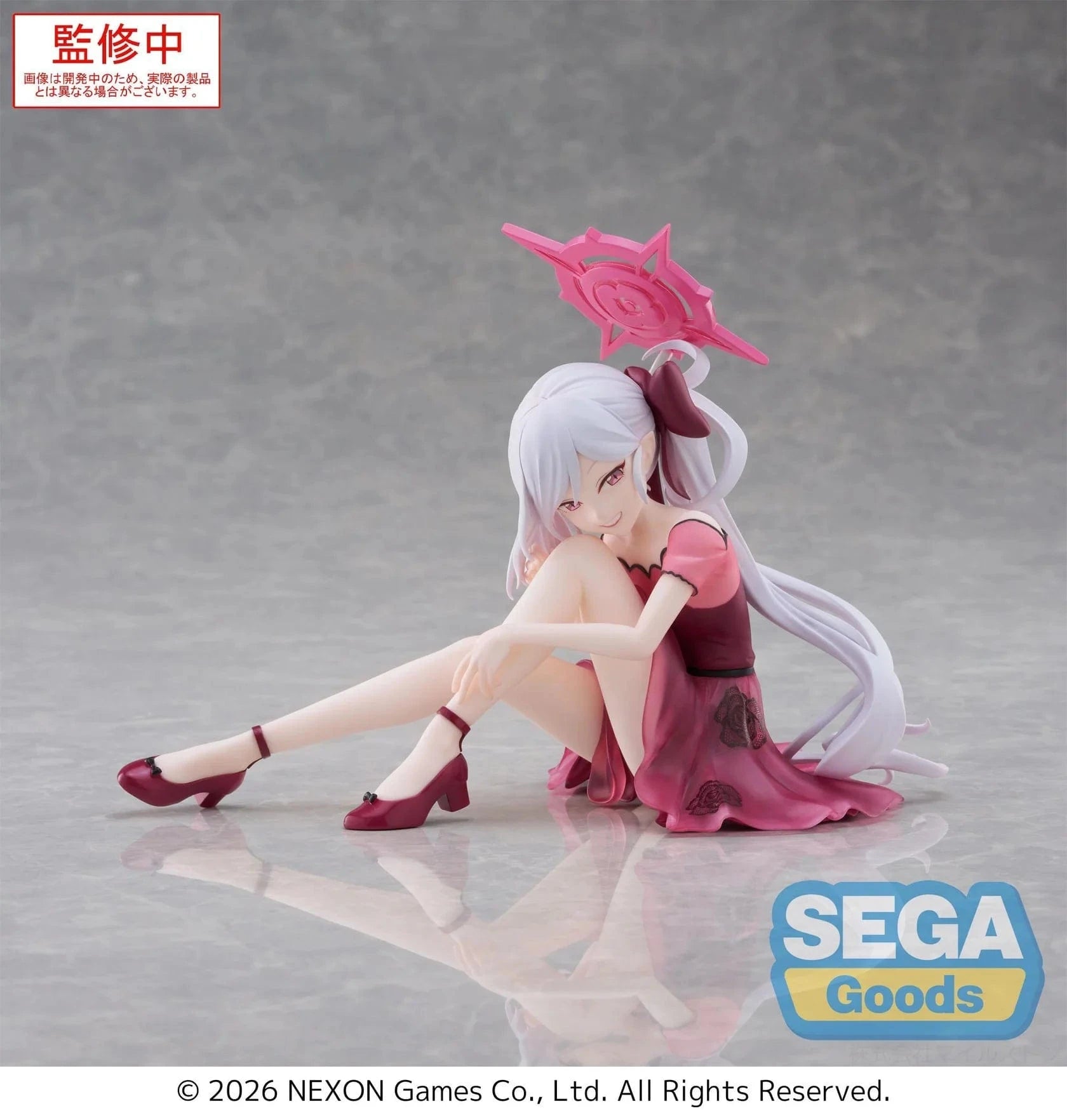 Blue Archive Yumemirize Mutsuki figure sitting in red dress with silver hair and playful expression