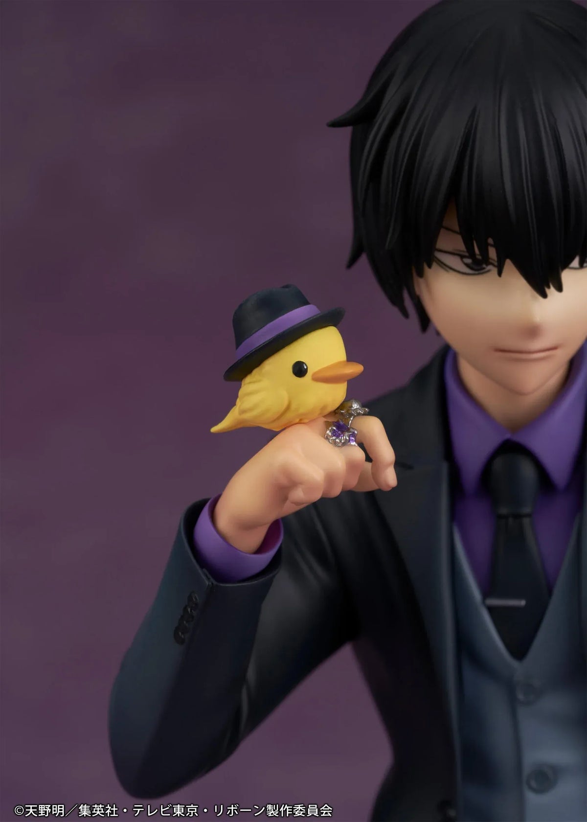 REBORN! Kyoya Hibari Scale Figure featuring a black-haired anime character wearing a black suit, purple shirt, gray vest, and tie, leaning against a wooden table with tonfa weapons while holding his yellow bird companion Hibird.