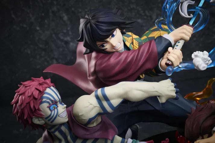 Demon Slayer Tanjiro Kamado, Giyu Tomioka, and Akaza vignette figure featuring translucent water and fire battle effects.