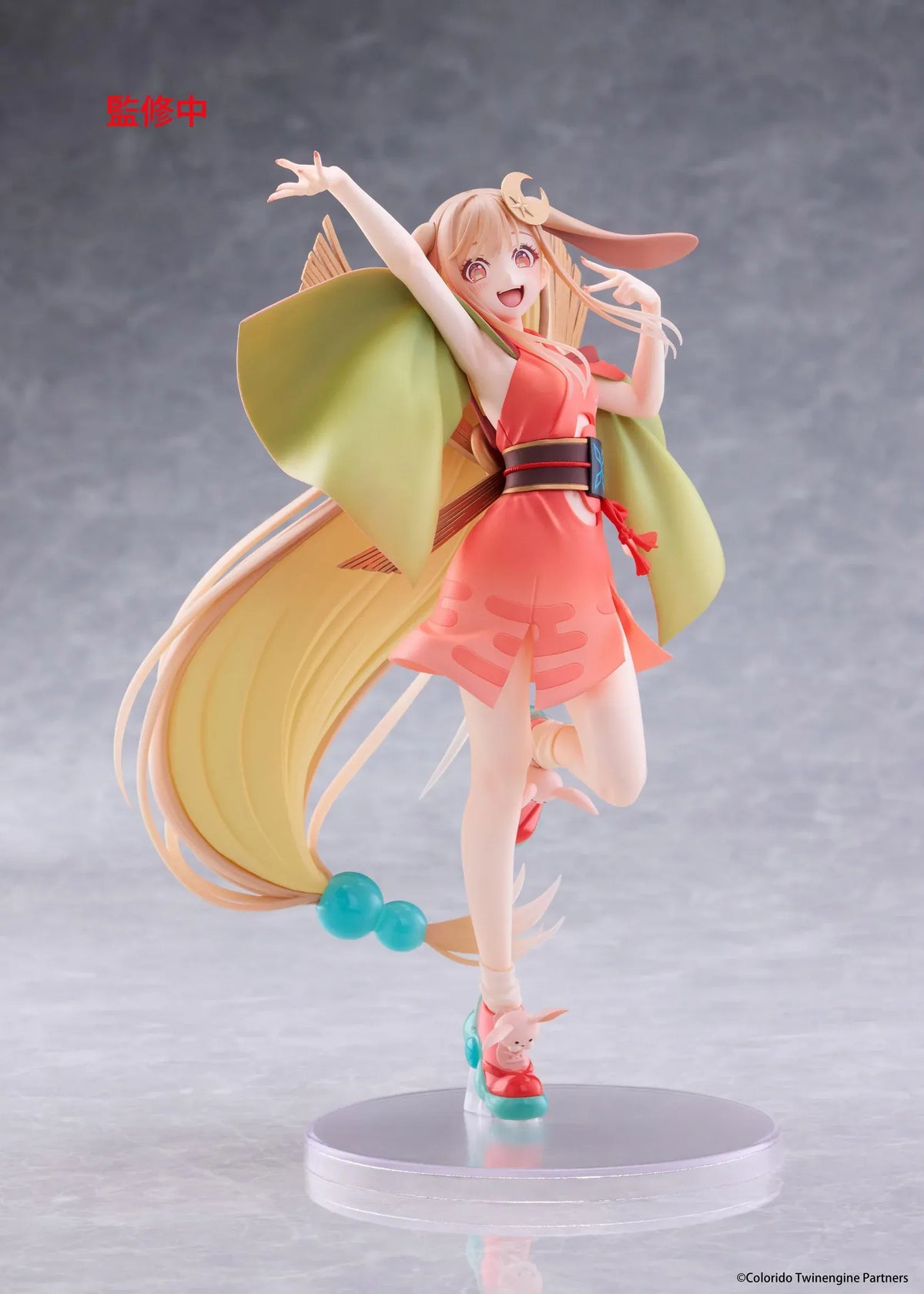 Cosmic Princess Kaguya! Kaguya VR Ver. Coreful Figure featuring a blonde-haired anime girl with pink eyes, long flowing hair, bunny ears, a crescent moon hair accessory, a coral-pink outfit with green sleeves, and colorful shoes in an energetic pose on a transparent circular base.