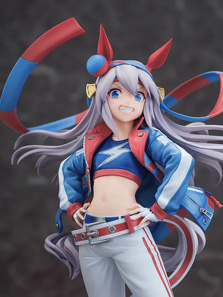 Uma Musume: Cinderella Gray Tamamo Cross 1/7 Scale Figure featuring Tamamo Cross in her vibrant blue and red racing jacket with confident pose and long flowing twin tails.