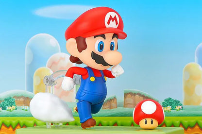Super Mario Nendoroid Mario figure wearing his red hat and blue overalls in a running pose