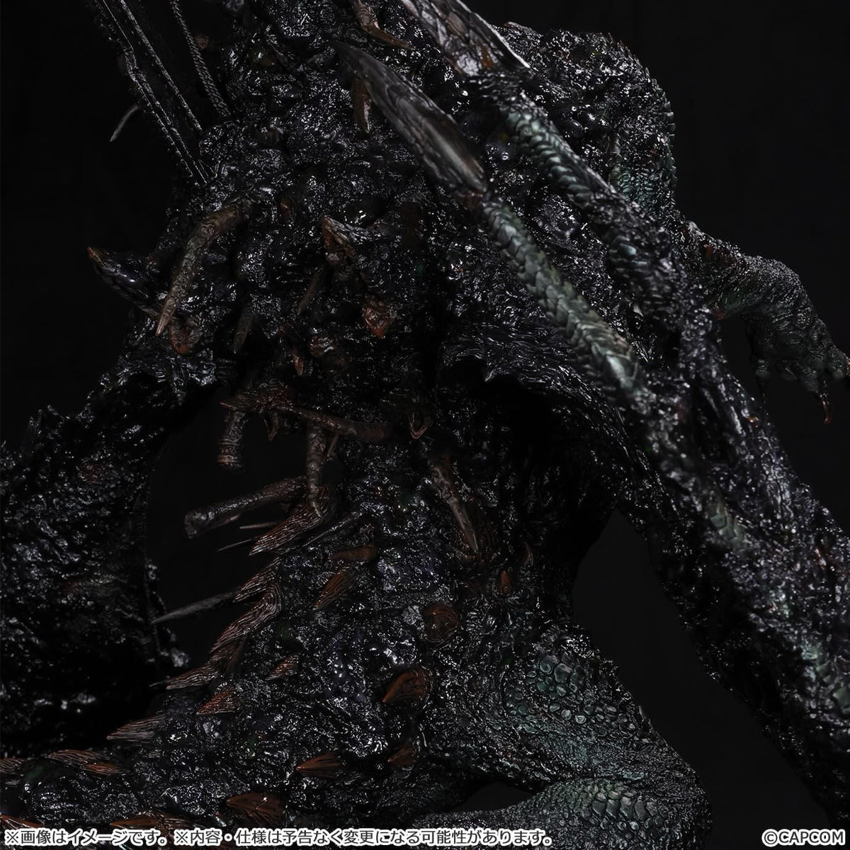 Monster Hunter Gogmazios Creator's Model XL figure roaring with dark textured scales, jagged spines, large claws, and red-orange chest accents.