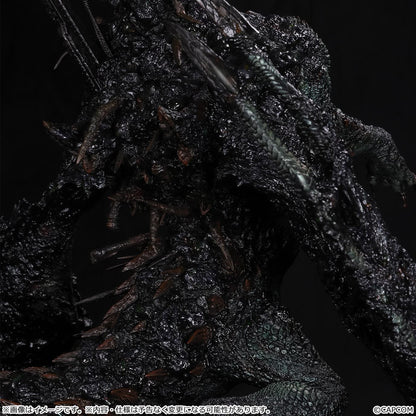 Monster Hunter Gogmazios Creator's Model XL figure roaring with dark textured scales, jagged spines, large claws, and red-orange chest accents.