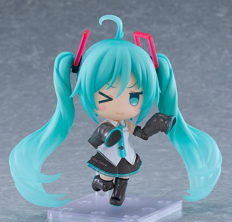 Hatsune Miku Nendoroid Hatsune Miku HMO Ver. Figure featuring Miku with teal twin tails, red glasses, colorful cable-style hair accessories, and music-inspired outfit details.