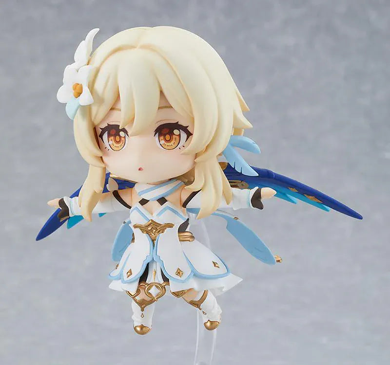 Genshin Impact Nendoroid Traveler Figure Lumine Rerelease featuring Lumine with blonde hair, golden eyes, white-and-blue fantasy outfit, flower hair accessory, and sword accessory.