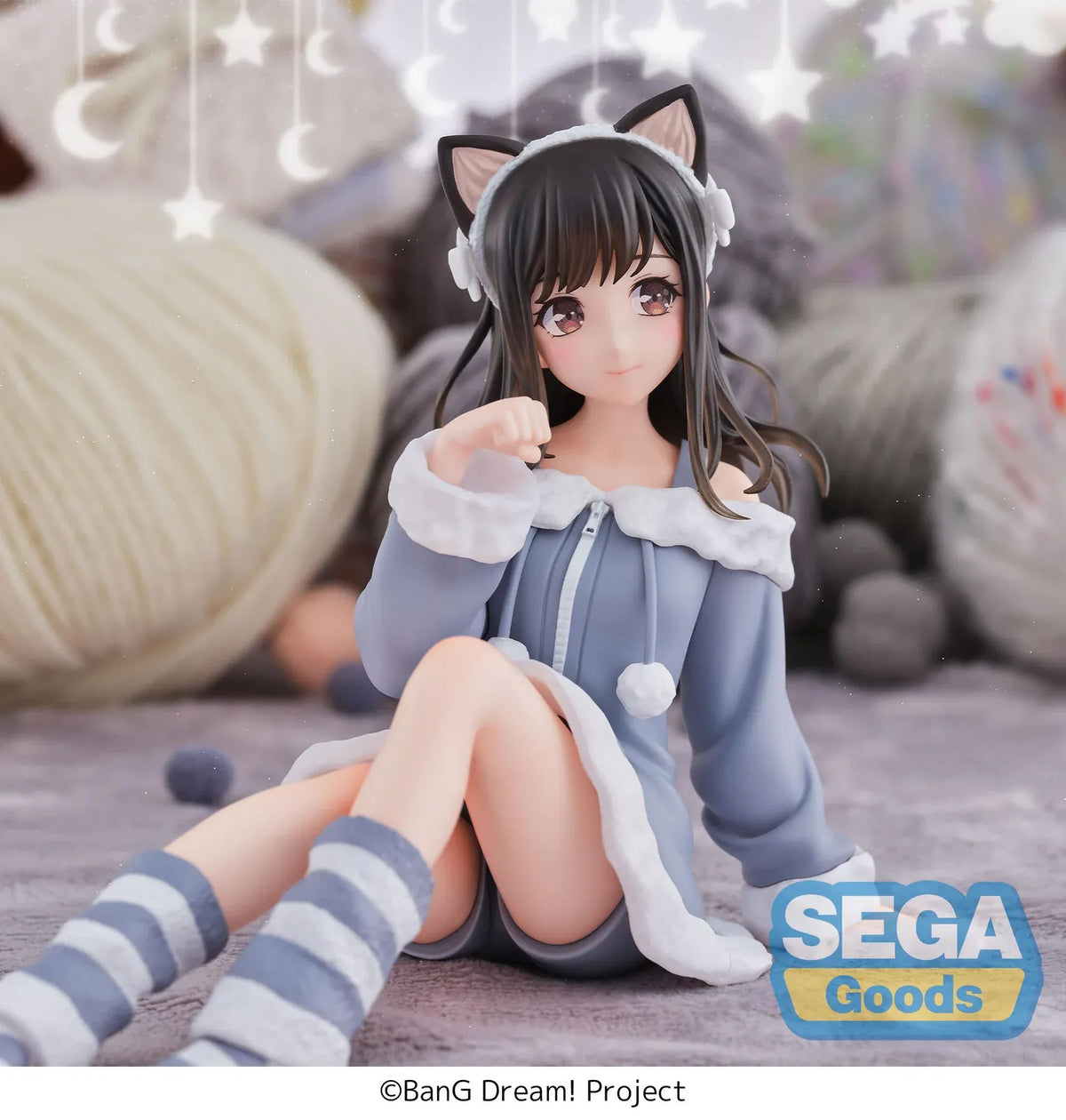 BanG Dream! Mana Sumita Pajama Party figure seated in a blue-gray outfit with white trim, cat-ear headband, striped socks, and one hand raised.