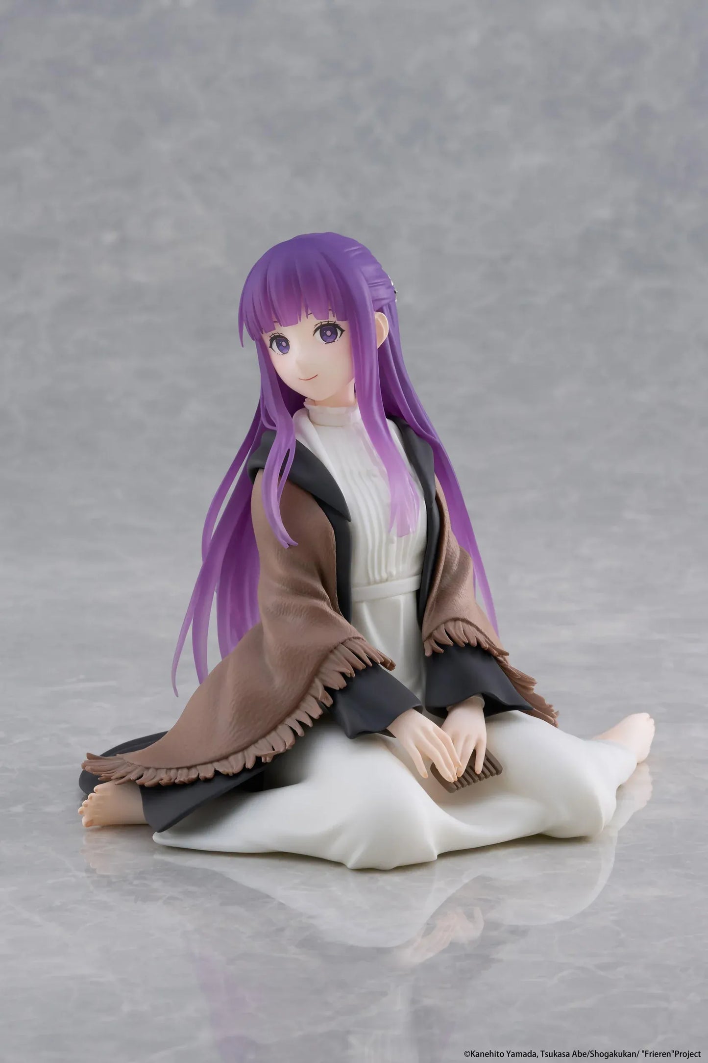 Frieren Beyond Journey's End Desktop Cute Fern Figure with purple hair wearing a shawl and white dress in a seated pose