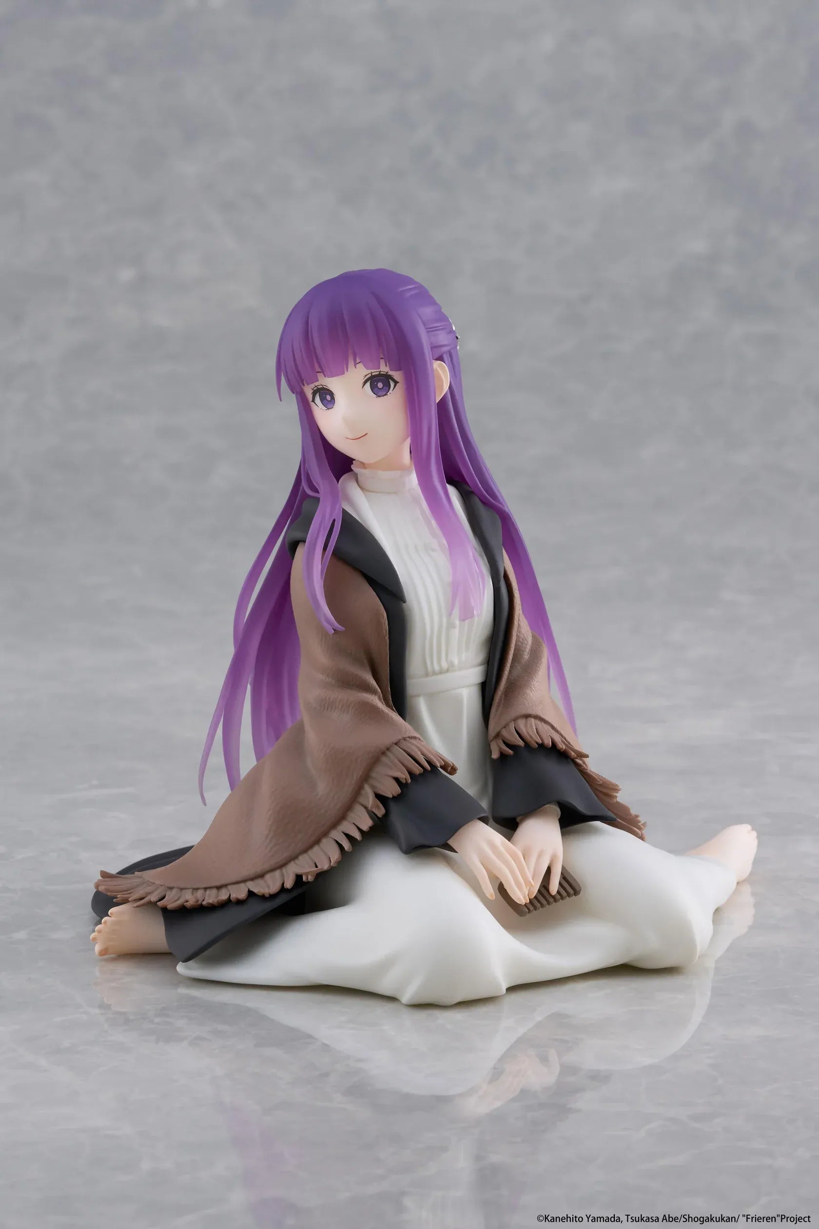 Frieren Beyond Journey's End Desktop Cute Fern Figure with purple hair wearing a shawl and white dress in a seated pose