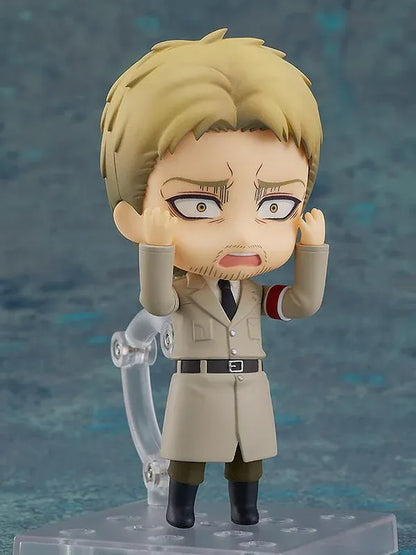 Attack on Titan Nendoroid Reiner Braun rerelease figure with blonde hair, facial stubble, crossed arms, and a tan Marleyan uniform.