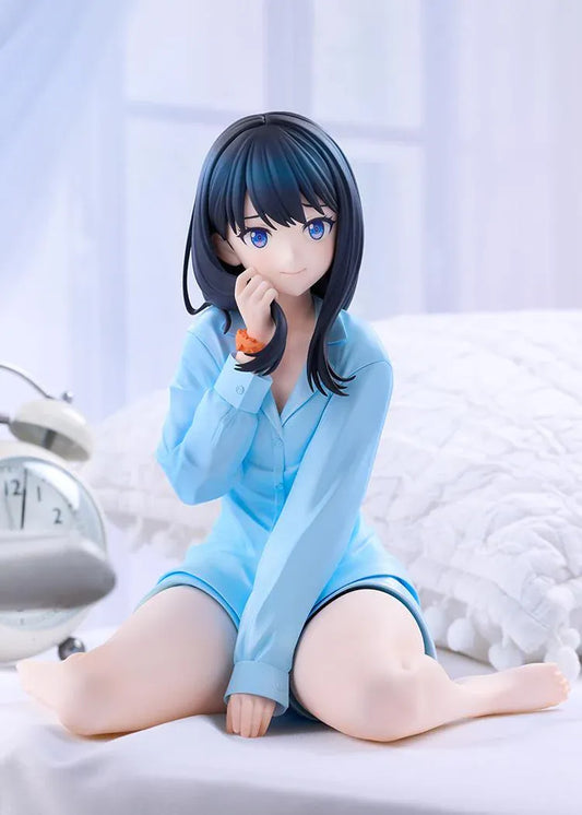 GRIDMAN UNIVERSE Rikka Takarada Pajamas Ver. figure seated in light blue pajamas, with dark hair, blue eyes, and an orange wrist scrunchie.