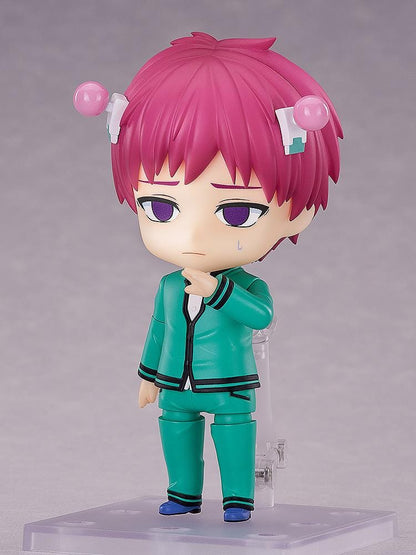 Kusuo Saiki Nendoroid with pink hair, pink-tipped head accessories, green glasses, and a teal school uniform, posed with one hand extended.
