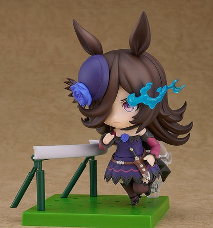 Umamusume Pretty Derby Nendoroid Rice Shower Figure (Rerelease) featuring a brown-haired horse girl with purple eyes, a miniature hat decorated with a blue rose, and an elegant purple and black racing outfit.