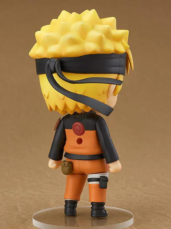 Chibi Nendoroid Naruto Uzumaki in orange jumpsuit performing the Shadow Clone Jutsu pose.