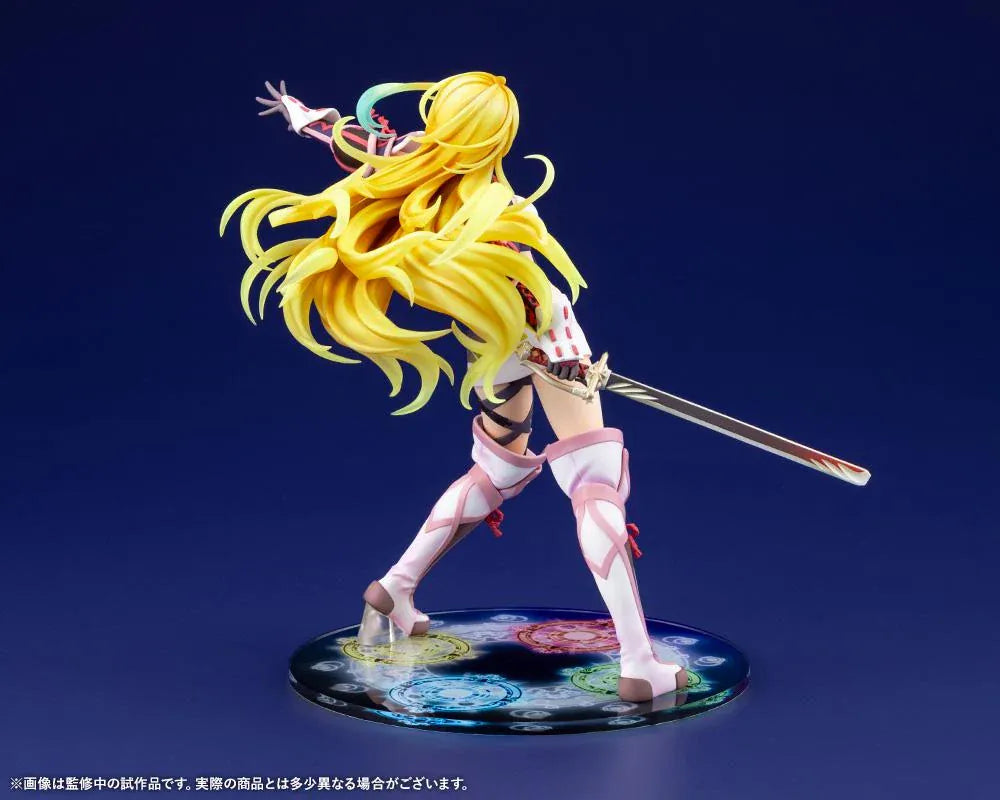 Tales of Xillia Milla Maxwell 1/8 scale figure holding a sword in a battle pose on a colorful elemental display base.
