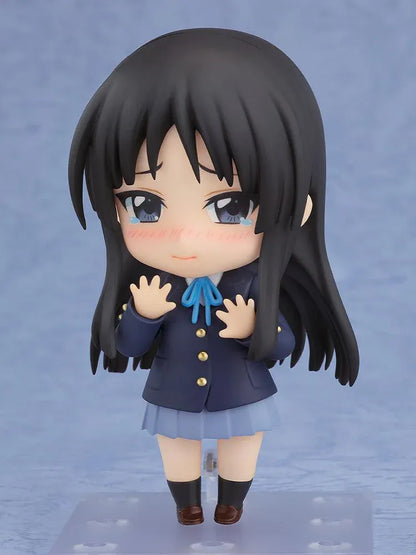 K-ON! Nendoroid Mio Akiyama 2.0 figure with long black hair, her school uniform, blue ribbon, and left-handed bass guitar.