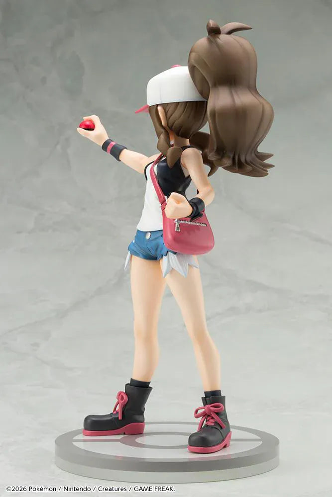 Pokemon ArtFX J Hilda with Tepig 1/8 Scale Figure Rerun featuring Hilda in her trainer outfit holding a Poké Ball with Tepig and flame effect on a display base.
