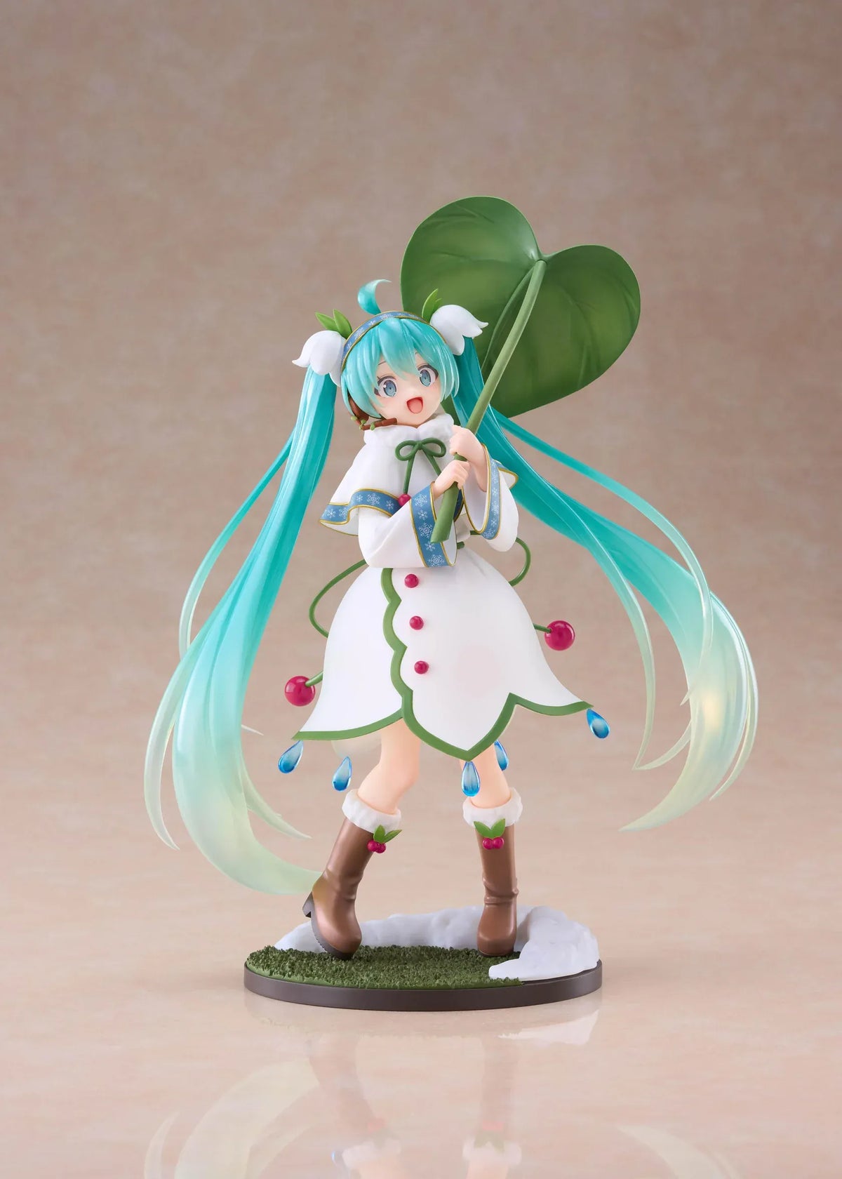 Snow Miku All Stars 2015 Ver. AMP+ figure wearing a white flower-inspired dress and holding an oversized green leaf.