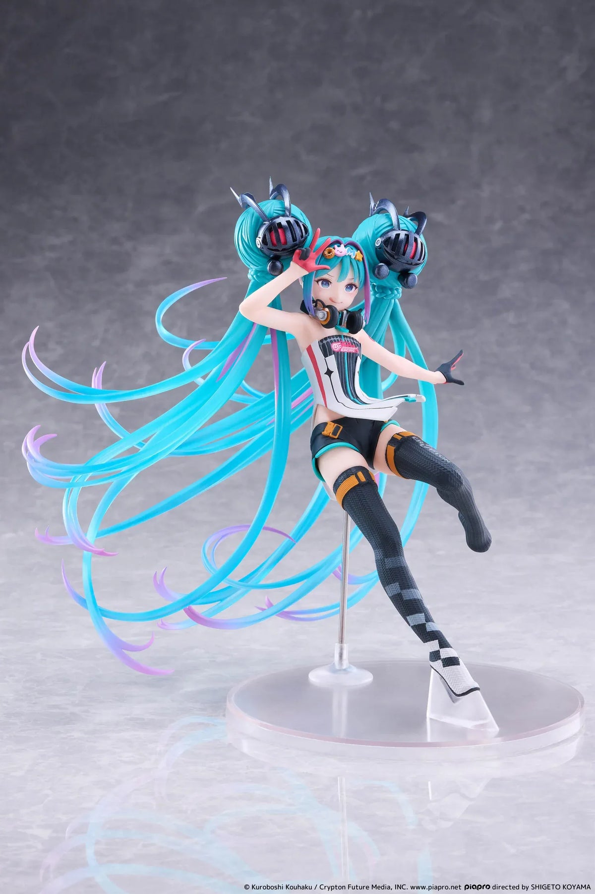 Hatsune Miku Taito Kuji Racing Miku 2026 figure wearing a futuristic racing outfit with flowing turquoise twin-tails and headphones.
