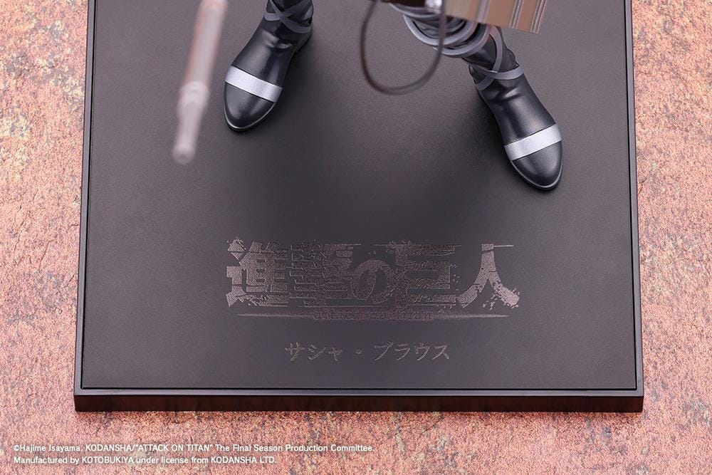 Sasha Blouse The Final Season Ver. Oshi Works figure holding a long rifle, wearing a black combat outfit with harness straps and equipment on a black base.