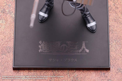 Sasha Blouse The Final Season Ver. Oshi Works figure holding a long rifle, wearing a black combat outfit with harness straps and equipment on a black base.