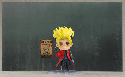 TRIGUN STARGAZE Vash the Stampede Nendoroid with spiky blond hair, orange glasses, a red coat, metallic teal mechanical arm, and raised handgun.