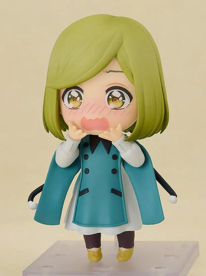 Nendoroid Coco figure from Witch Hat Atelier wearing witch hat and teal outfit in chibi style