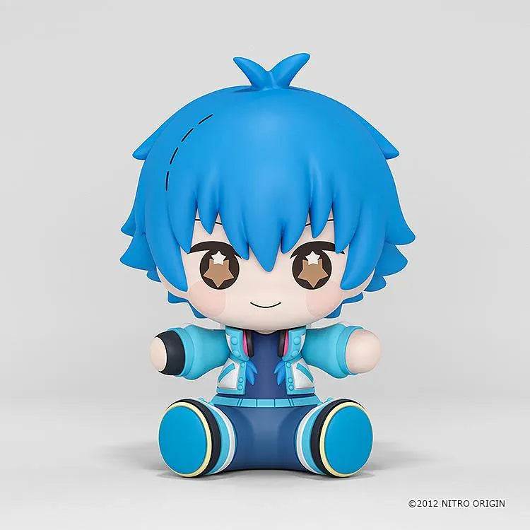DRAMAtical Murder Huggy Good Smile Aoba figure with blue hair, star-filled eyes, headphones, and a blue-and-white outfit in a seated pose.