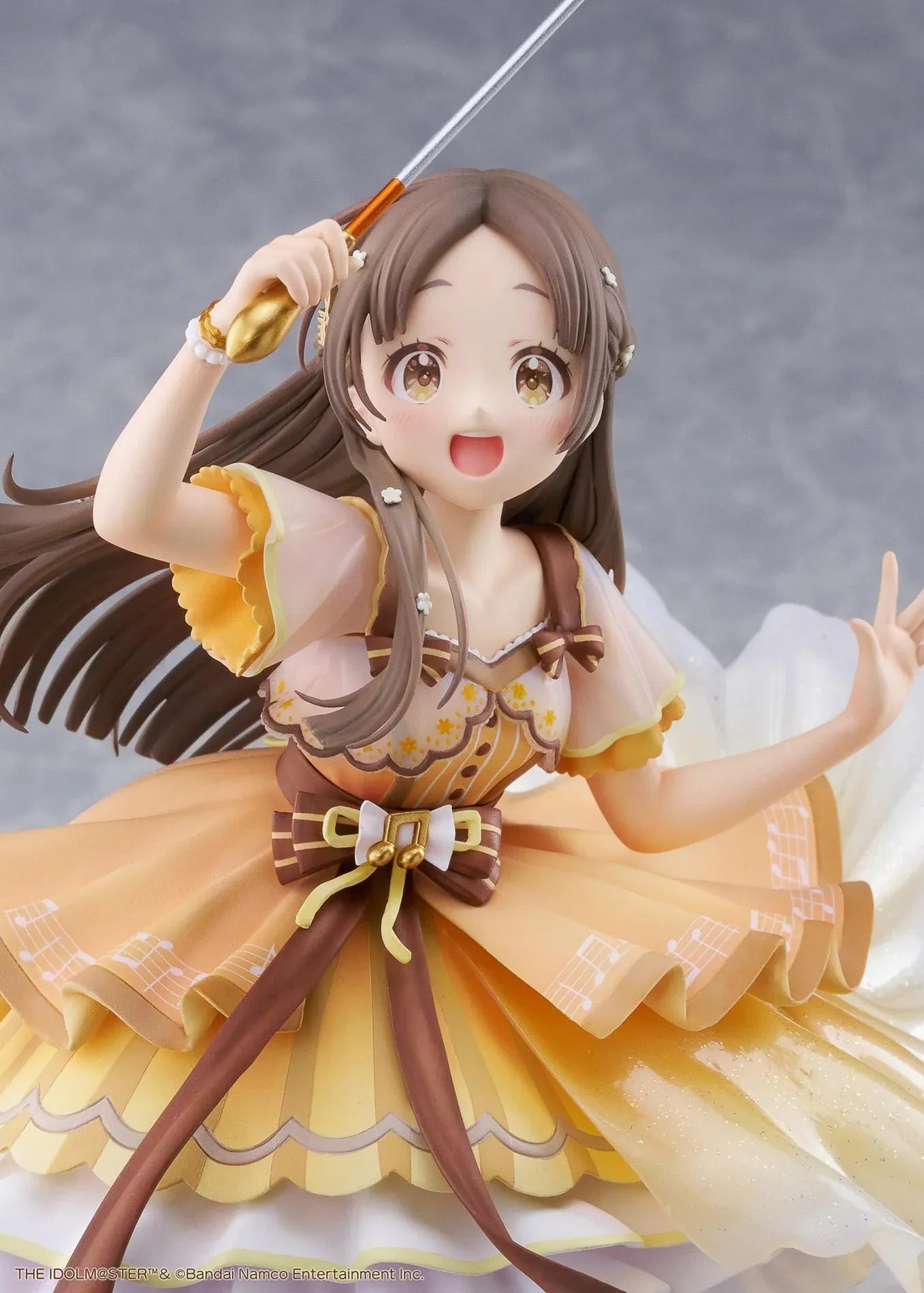 The Idolmaster Gakuen China Kuramoto 1/7 scale anime figure in a flowing yellow stage dress holding a microphone