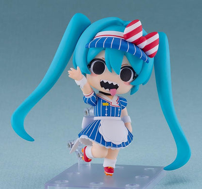 Hatsune Miku Nendoroid Hatsune Miku Mesmerizer Ver. Figure featuring Miku in a chibi-style design with teal twin tails, striped blue outfit, red and white bow, and apron-style details.