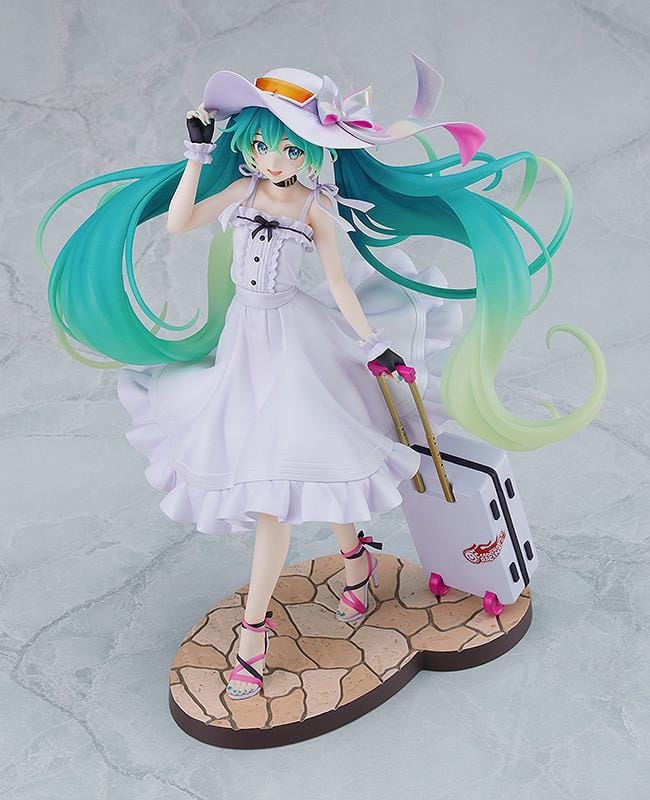 Racing Miku 2021 Private Ver. figure in a white dress and wide-brimmed hat, with turquoise twin-tails and a rolling suitcase on a stone-style base.